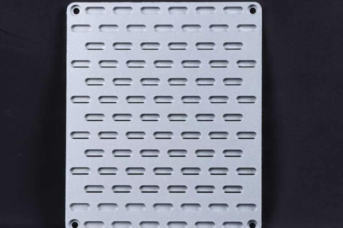 Close detail of a silver anodized ventilated panel finish