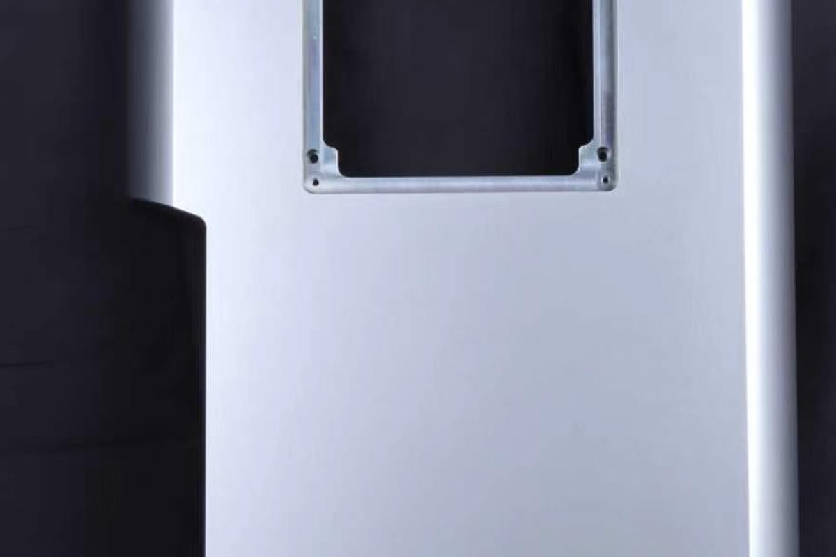 Close detail of an anodized housing surface and machined opening edge