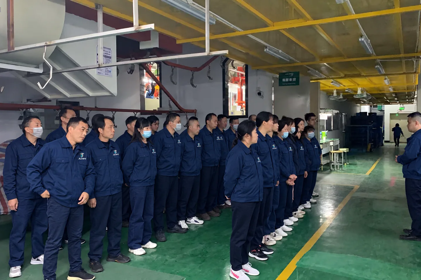 JLYPT factory team attending a production briefing