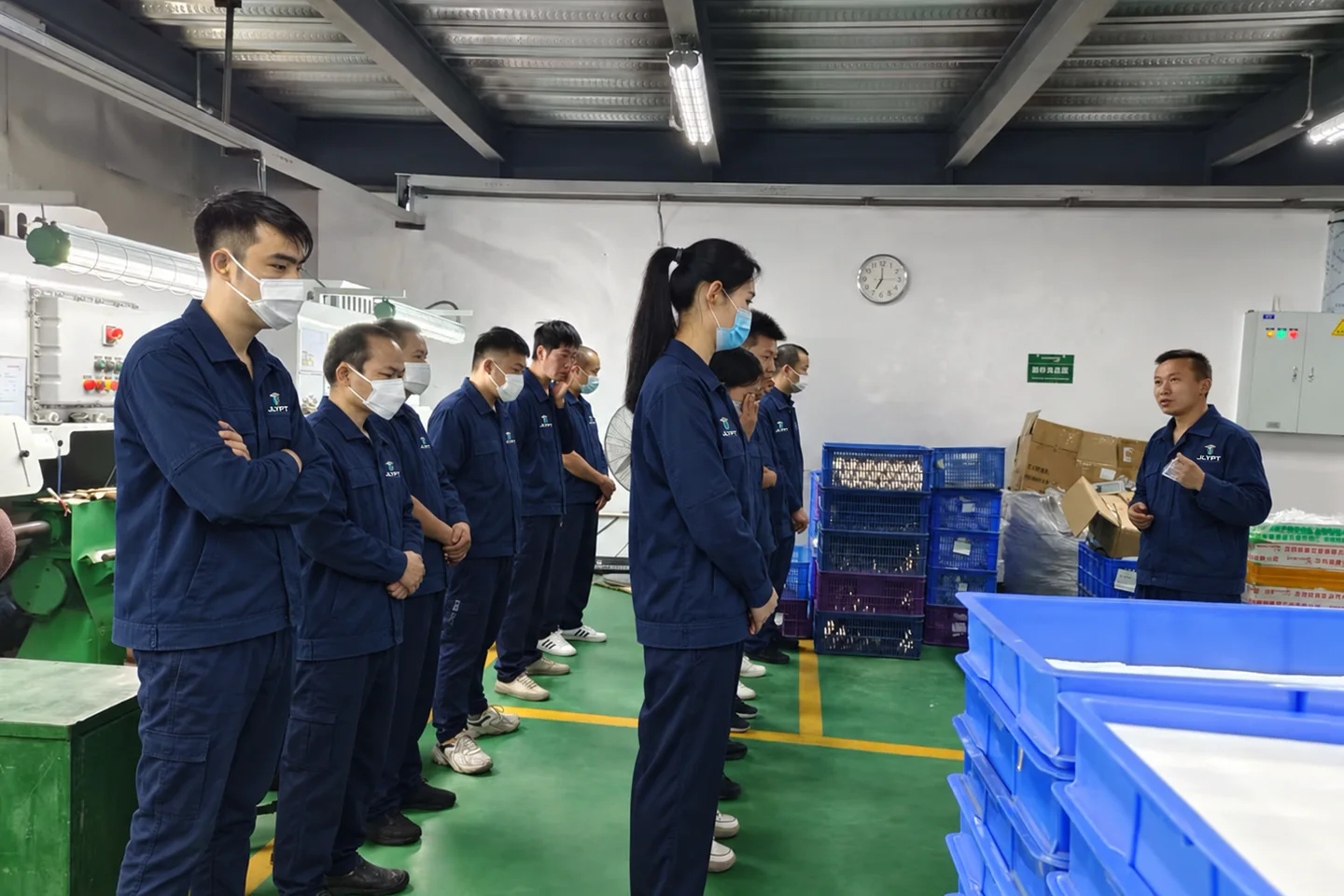 JLYPT team receiving process training on the shop floor