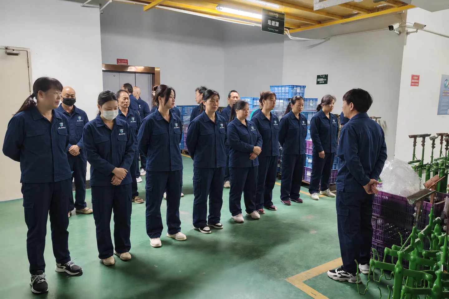 JLYPT factory-floor team briefing